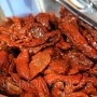 Sundried Tomatoes with tongs